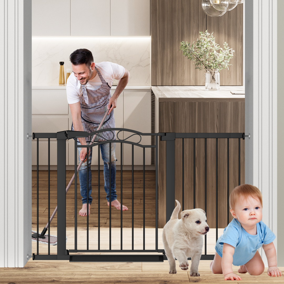Black metal baby gate with small dog door, pressure mounted safety gate for toddlers and puppies in kitchen